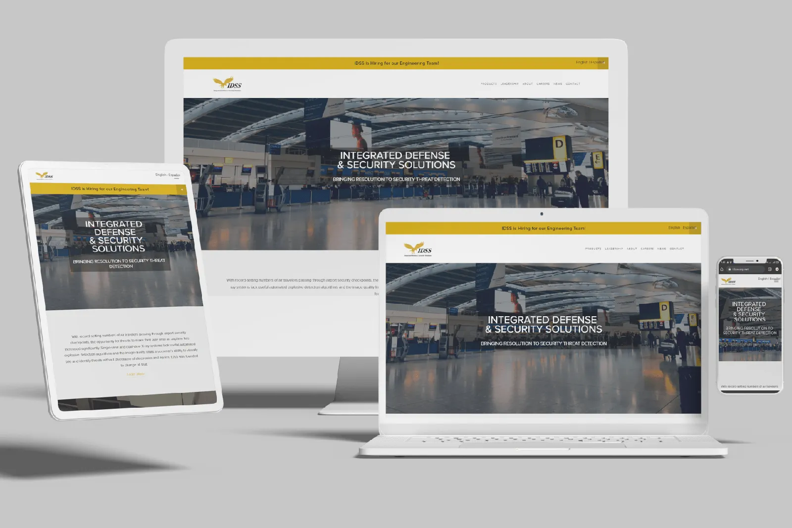 Security systems manufacturer website shown on desktop, laptop, tablet and phone