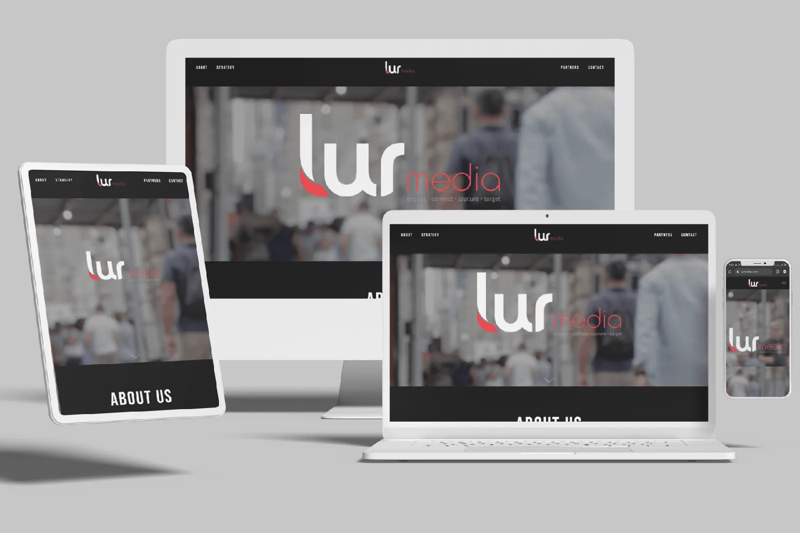 Marketing firm website shown on desktop, laptop, tablet and phone